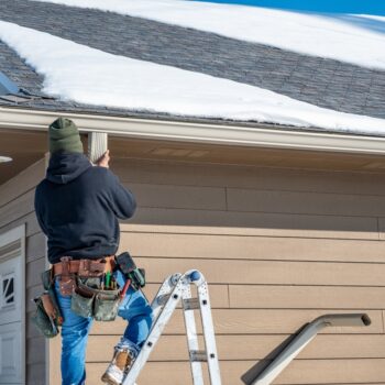 Cleaning Gutters in the Cold
