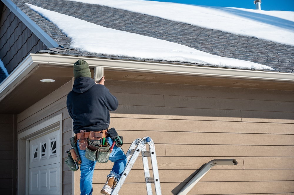 Cleaning Gutters in the Cold